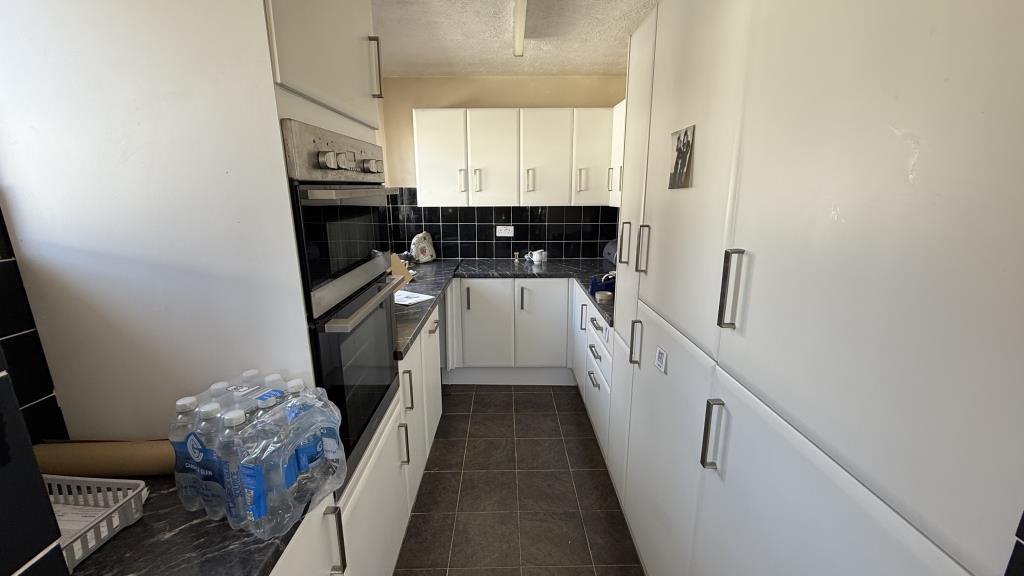 Lot: 140 - SEMI-DETACHED BUNGALOW FOR REFURBISHMENT - Internal image of kitchen